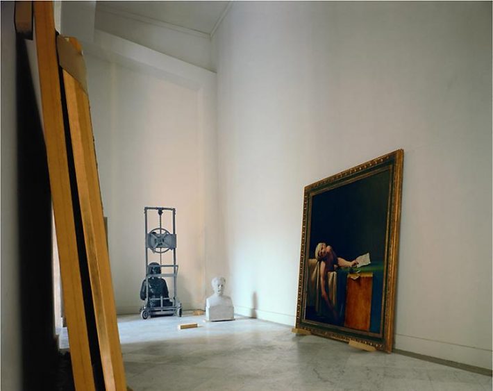 Leaning against a wall, seemingly unattended, the Marat assassiné, 1793, by a’telier of David. Photographed in 1985, Edwynn Houk Gallery.