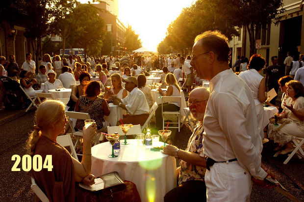 STAFF PHOTO BY ALEX BRANDON The crowd enjoyed the sunset at White Linen night on Julia Street in New Orleans on Saturday, August 7, 2004.