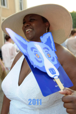 MATTHEW HINTON / THE TIMES-PICAYUNE Shannon Guy from New Orleans keeps cool with a George Rodrigue Blue Dog fan on White Linen Night on Julia Street, Saturday, August 6, 2011 in New Orleans, La. 