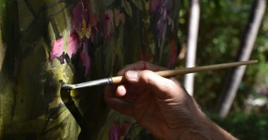 John Alexander uses flowers in the garden at Eaton Fine Art for his new series of paintings. 