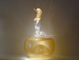 Putto Riding Golden Octopus on Amber Base